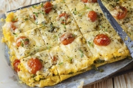 Baked Polenta With Sun Dried Tomatoes, Cheese, and Herbs